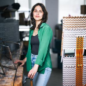 Alina Tenser standing in her studio.