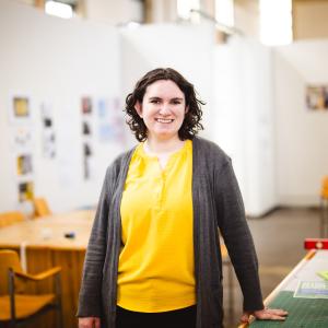 Jenny Kowalski standing in her studio.