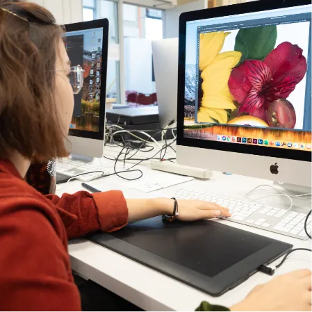 Student doing design work on a computer.
