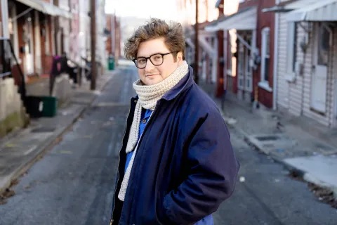 Wes Hiatt standing in an alley.