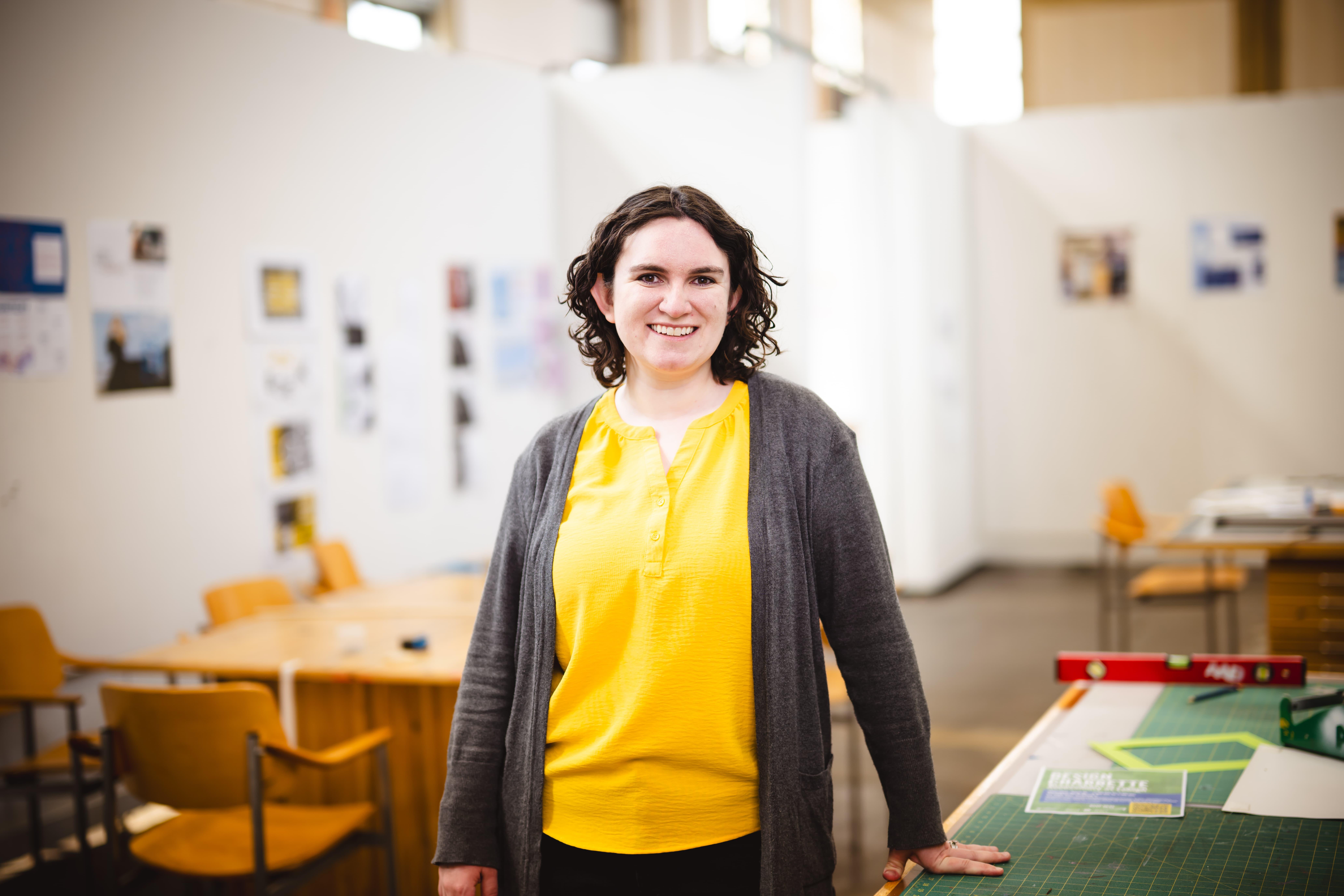 Jenny Kowalski standing in her studio.