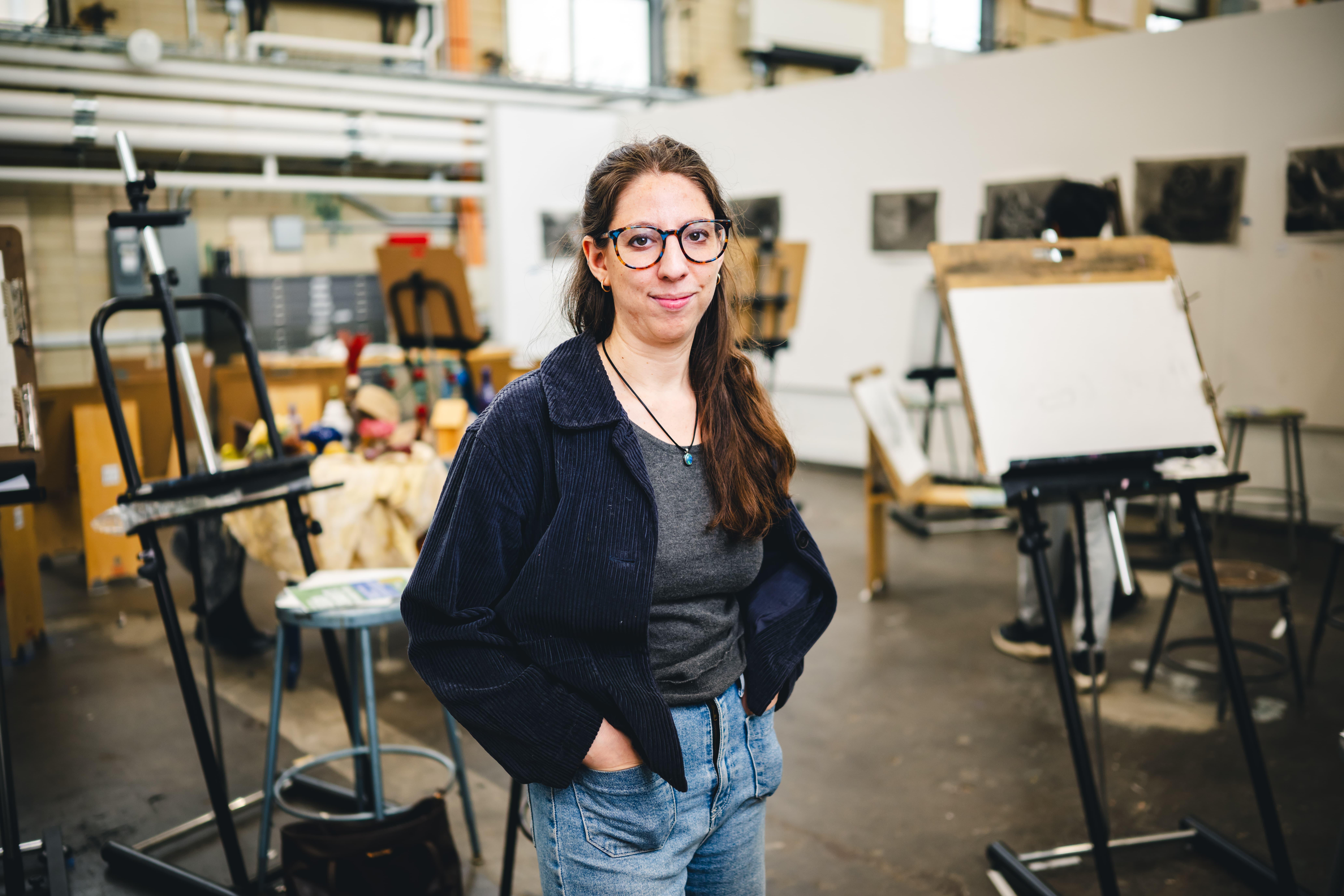 Maren Less standing in her studio.