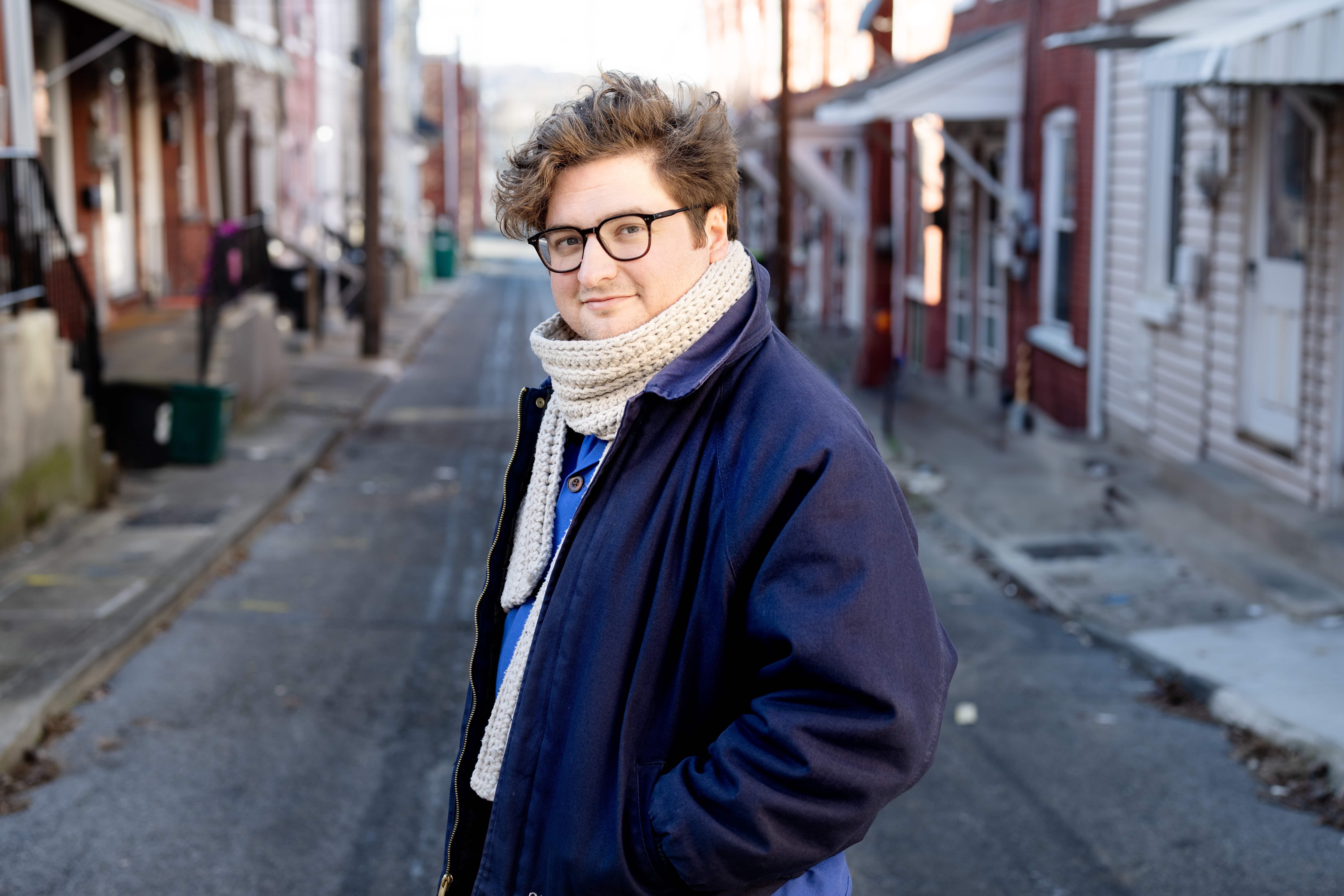 Wes Hiatt standing in an alley.
