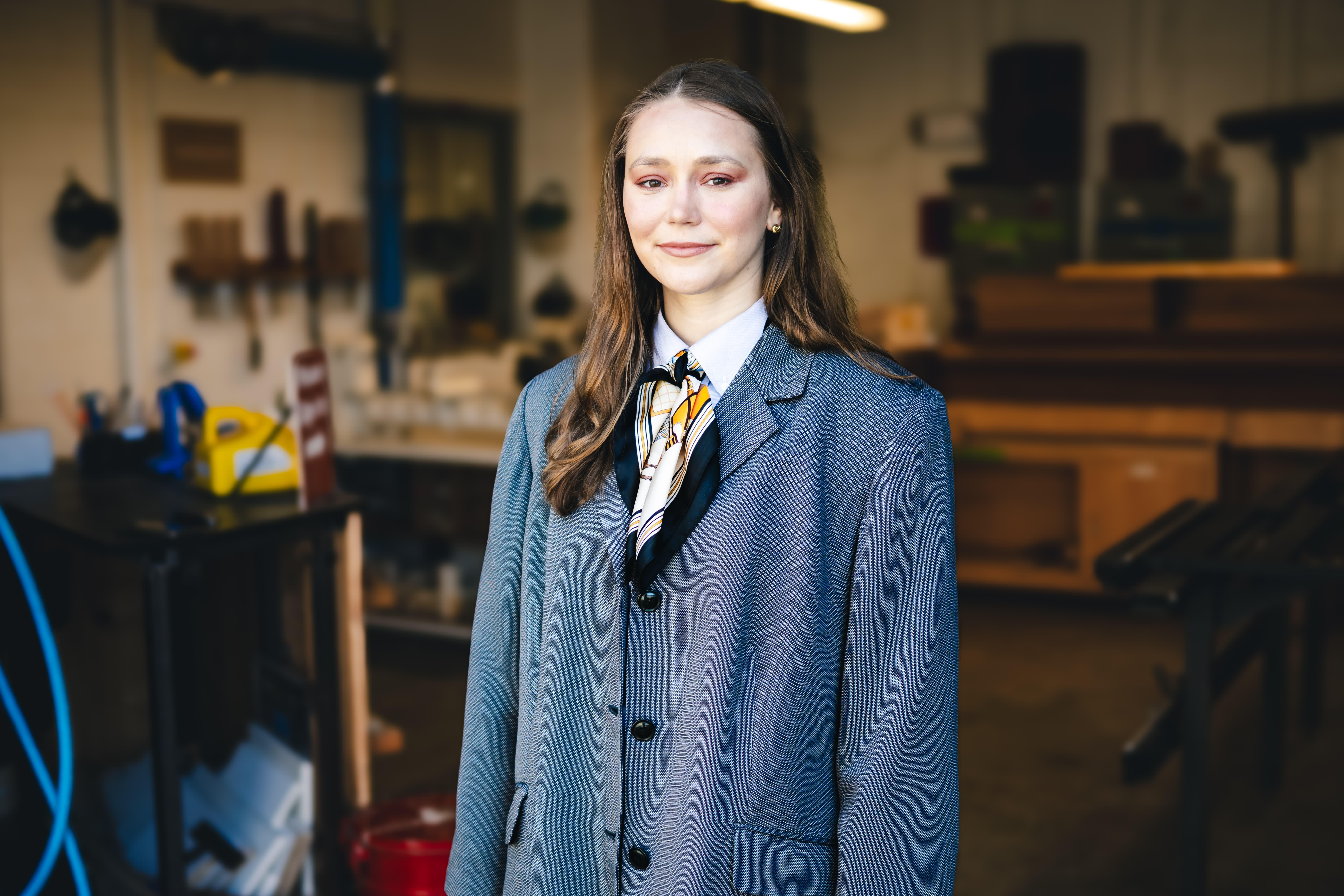 Mallory Kimmel standing in her studio.
