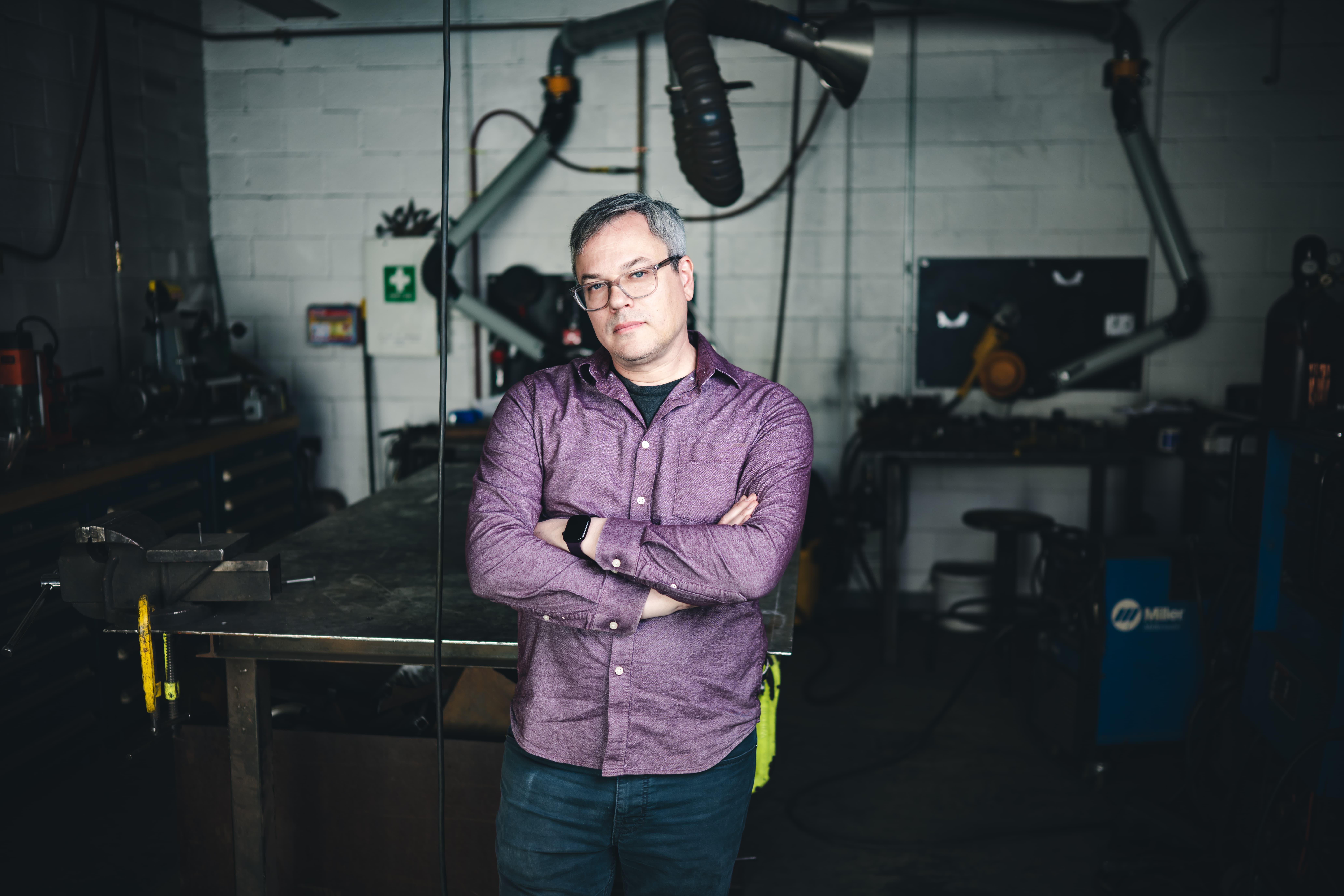 Wes Heiss standing in his studio.