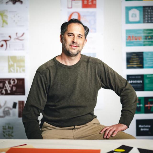 Kevin Lahoda sitting in his studio.