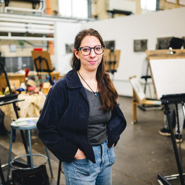 Maren Less standing in her studio.