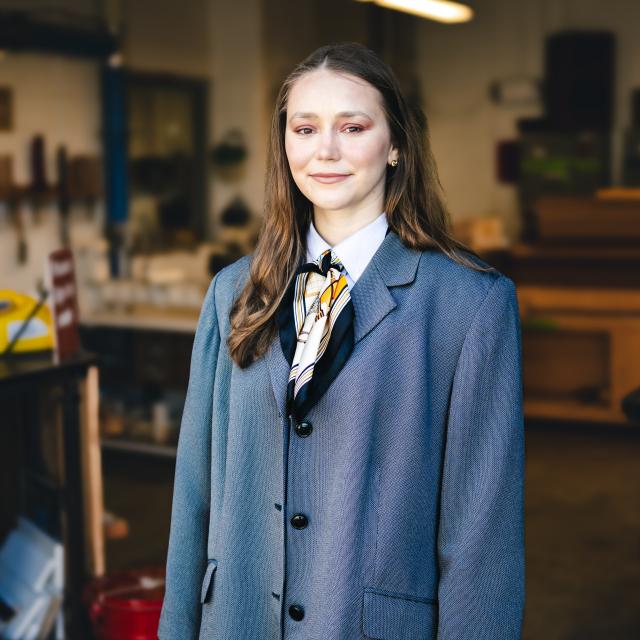 Mallory Kimmel standing in her studio.