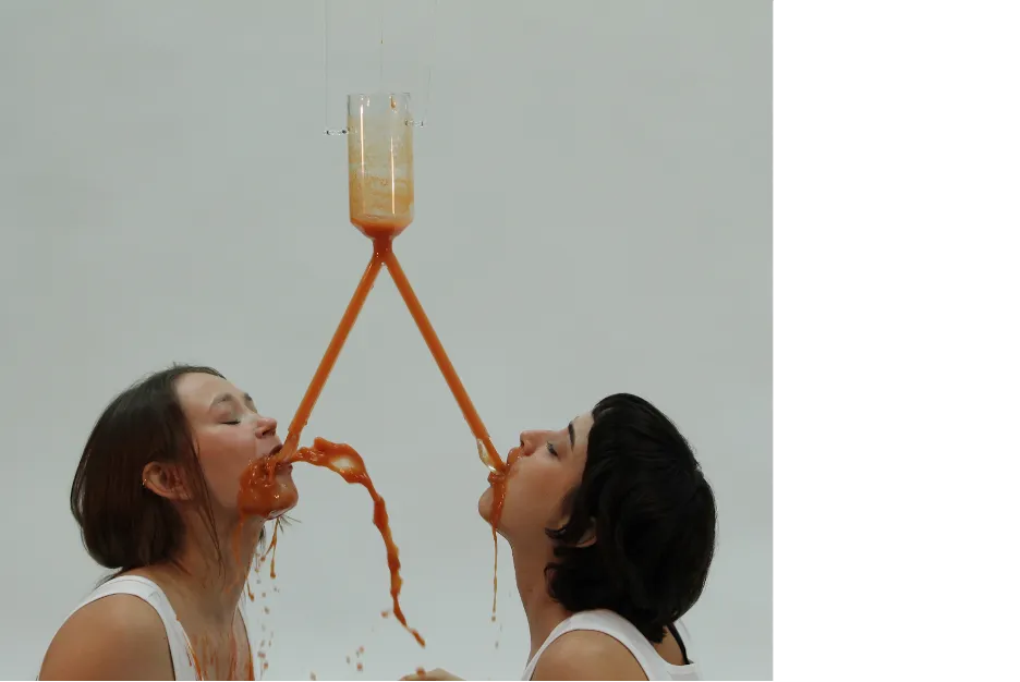 Mallory Kimmel's Hands-Free Spoon exemplifies a two-person shared experience with an intentionally clunky, over-optimized object (hands-free spoon apparatus) and a performance of the rapid, messy consumption of a can of soup in under a minute to illustrate the sheer idiocracy of redesigning a spoon to be a hands-free contraption. 