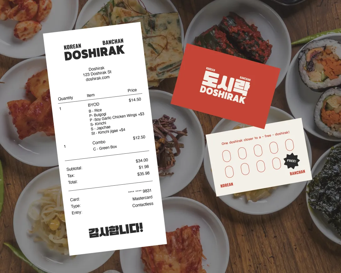 Receipt and loyalty card placed above image of Korean banchan, or side dishes