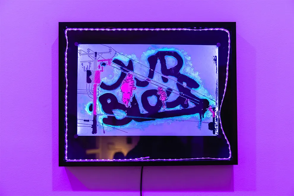 Mixed-media artwork in a black frame illuminated with UV LED lights, featuring layered graffiti-style lettering, abstract telephone wire drawings, and neon red and blue UV reactive splatters.