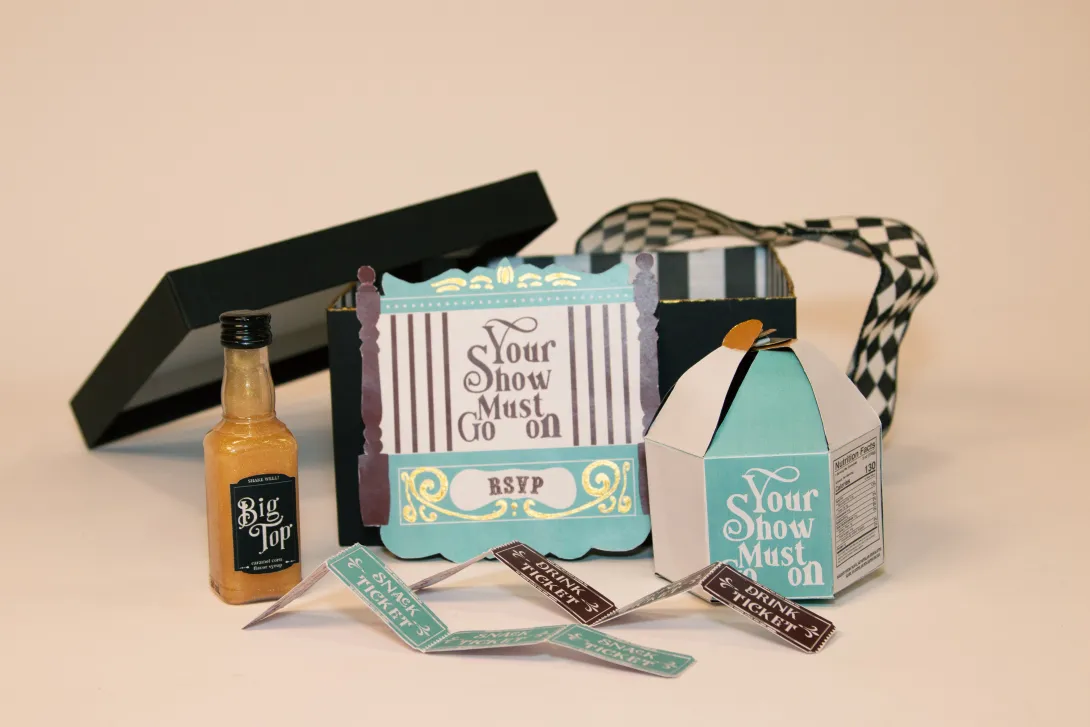 PR box - handcrafted popcorn box, a drink syrup bottle, an RSVP card, and custom-designed drink, snack, and game tickets